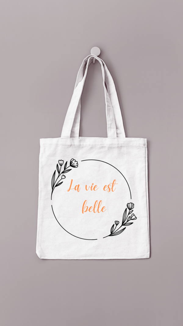 Sac de couleur crème floqué "La vie est belle" avec un cadre de fleurs